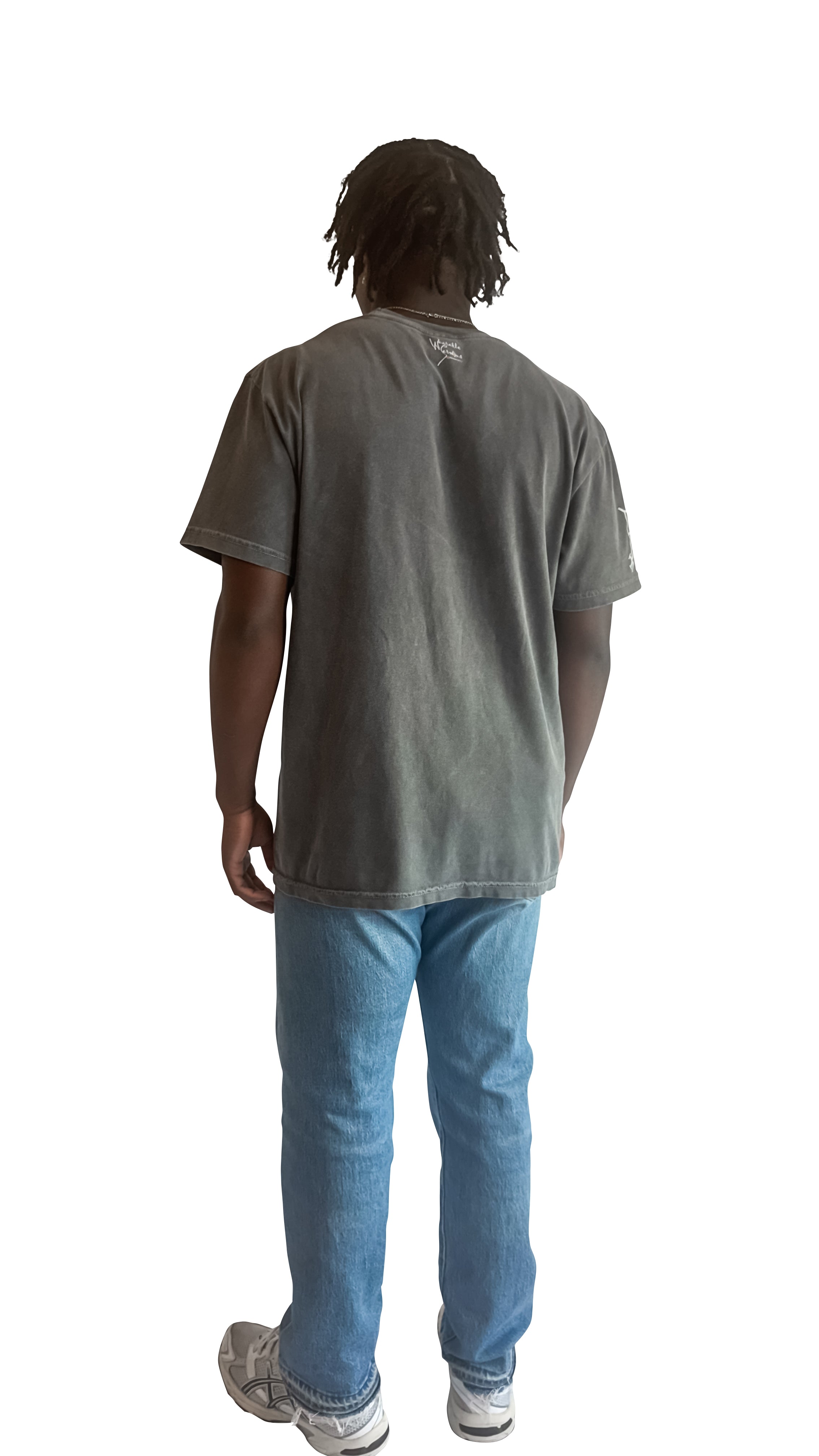 Person wearing a dark gray t-shirt and blue jeans on a white background