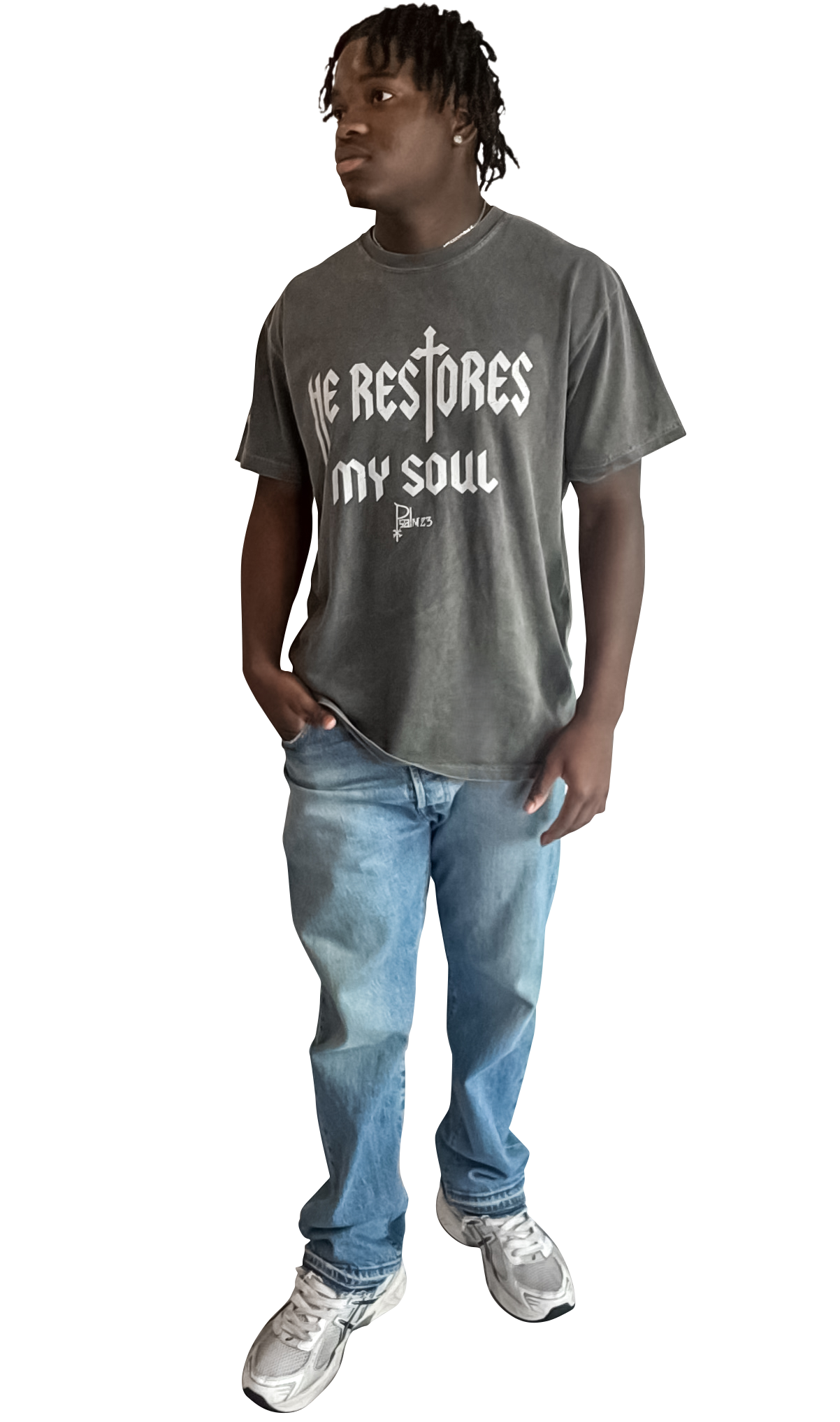 Person wearing a gray t-shirt with text and blue jeans on a white background