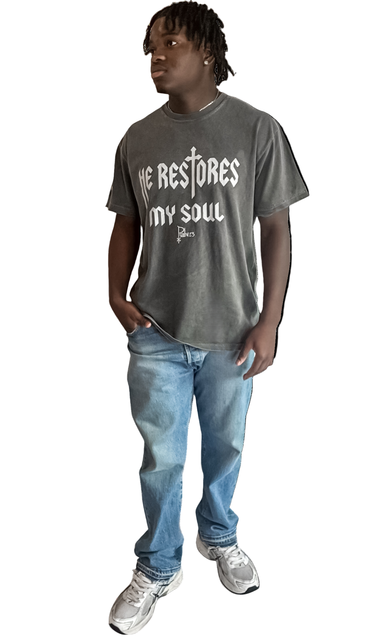 Person wearing a gray t-shirt with text and blue jeans on a white background